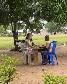 Lauren with a student